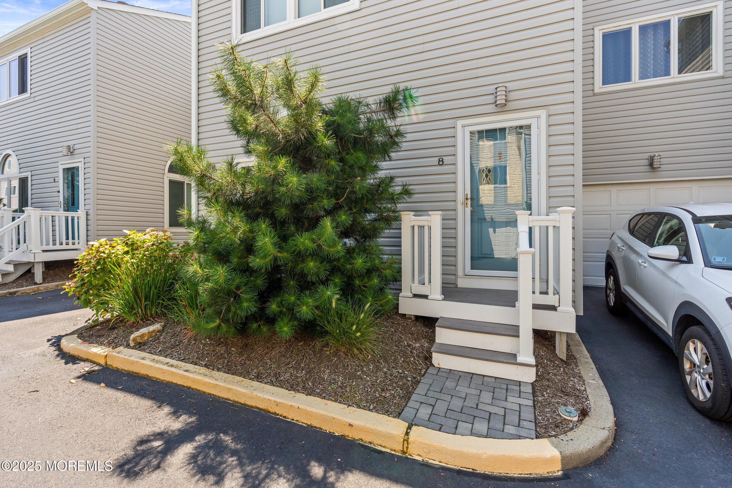 450 Ocean Boulevard, Unit 8 Long Branch, NJ 07740 - Photo 32 of 33 a view of a back yard of the house