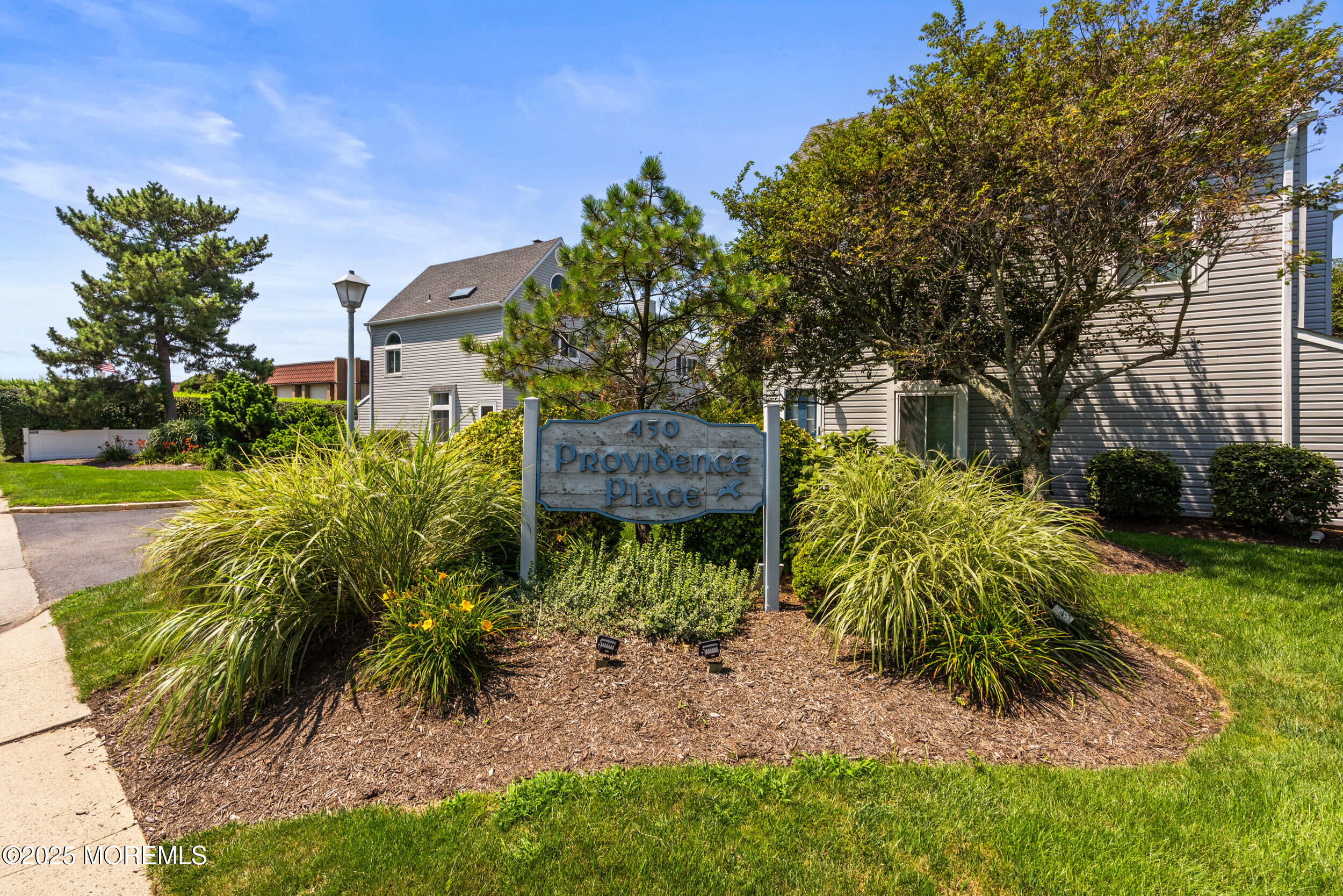450 Ocean Boulevard, Unit 8 Long Branch, NJ 07740 - Photo 33 of 33 a view of a garden with plants and large trees