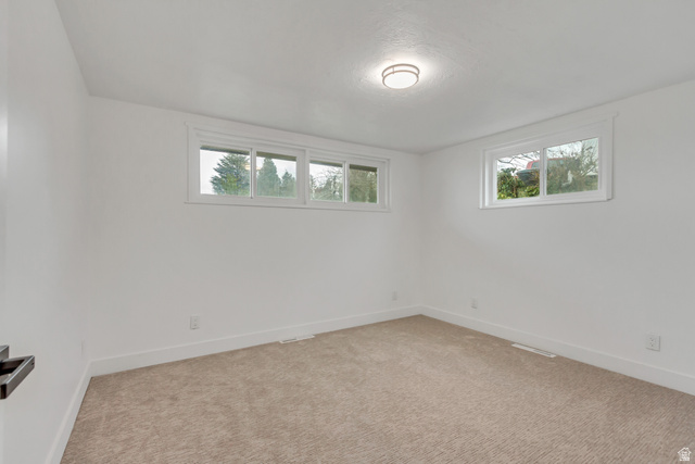 337 West 2900th Street South Bountiful, UT 84010 - Photo 20 of 35 Carpeted spare room featuring baseboards