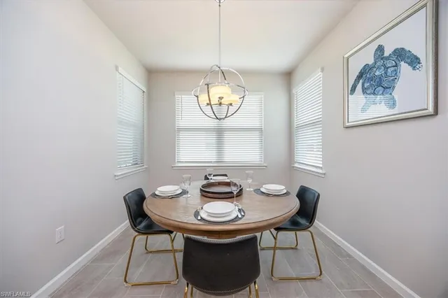 a table and chairs in a small room