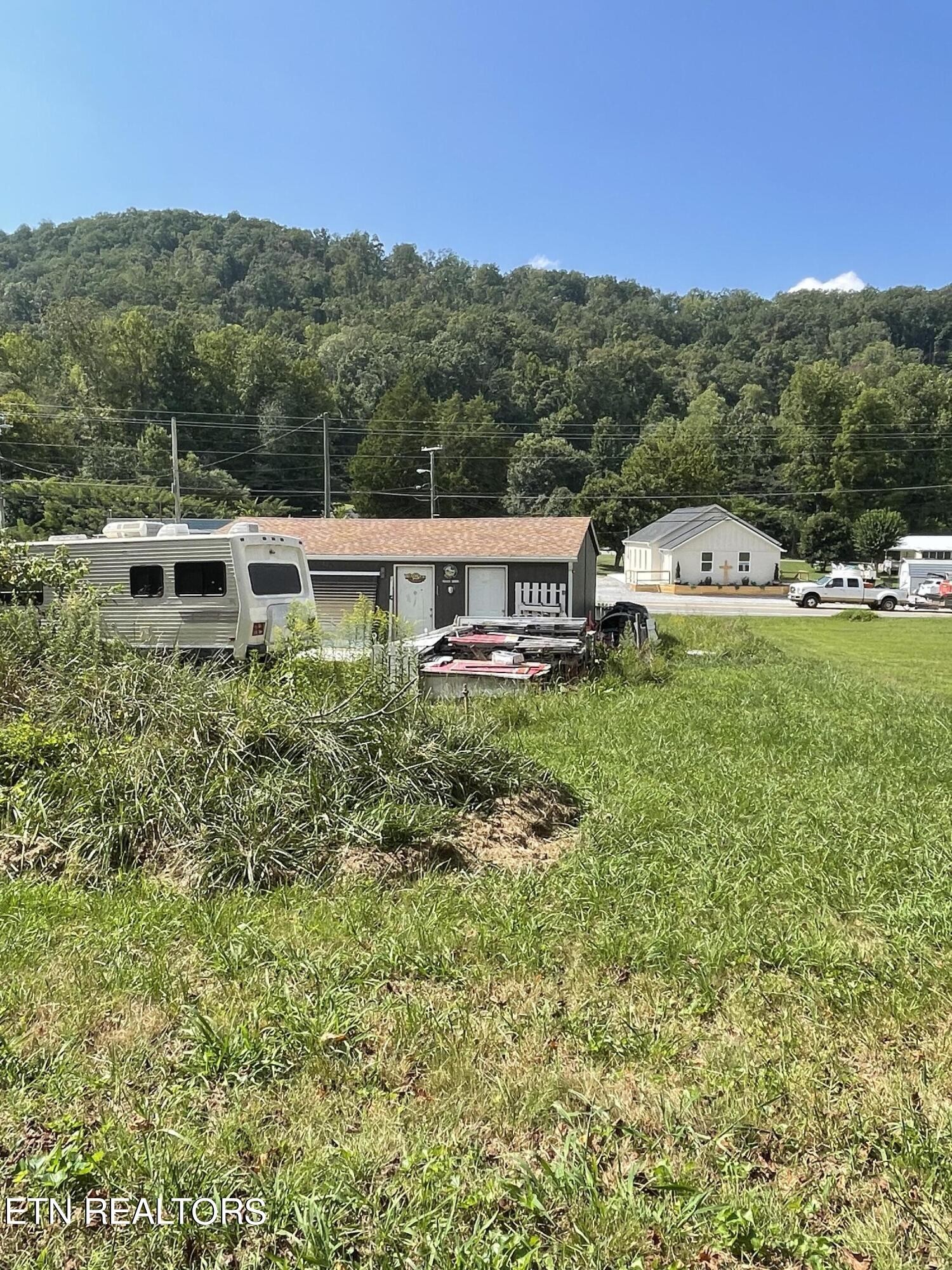 0 Wilson Road Oliver Springs, TN 37840 - Photo 2 of 2 a view of a big yard with mountain