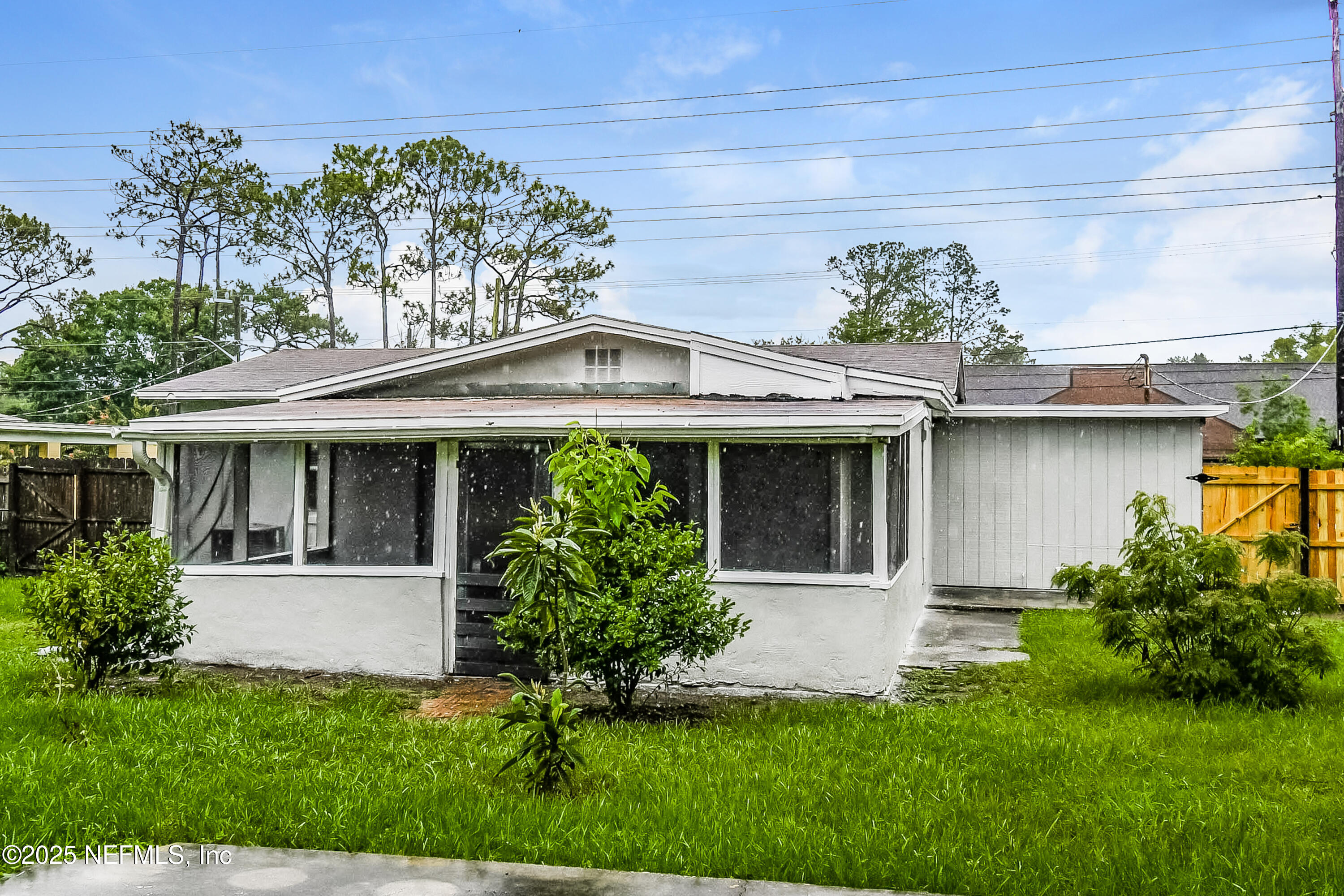 10429 Anders Boulevard Jacksonville, FL 32246 - Photo 15 of 15 a front view of a house with a yard and potted plants