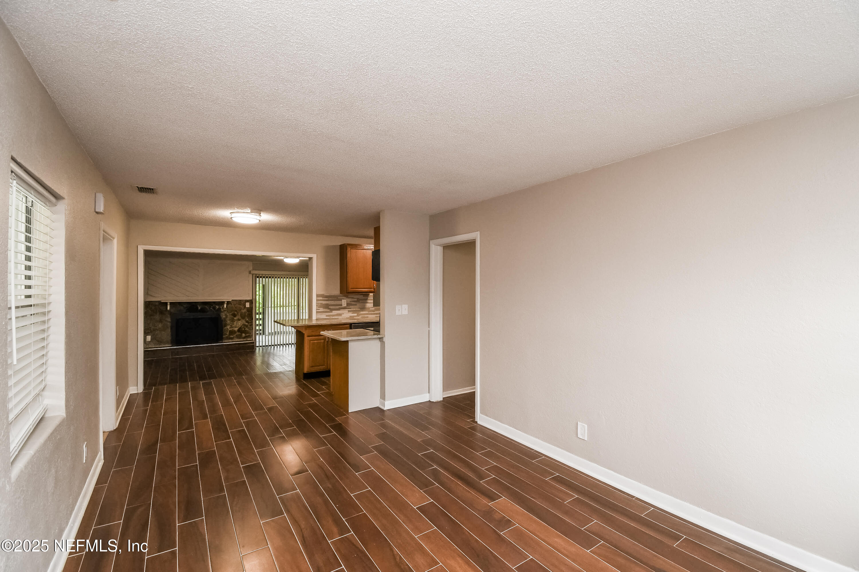 10429 Anders Boulevard Jacksonville, FL 32246 - Photo 3 of 15 a view of a kitchen with wooden floor and a window