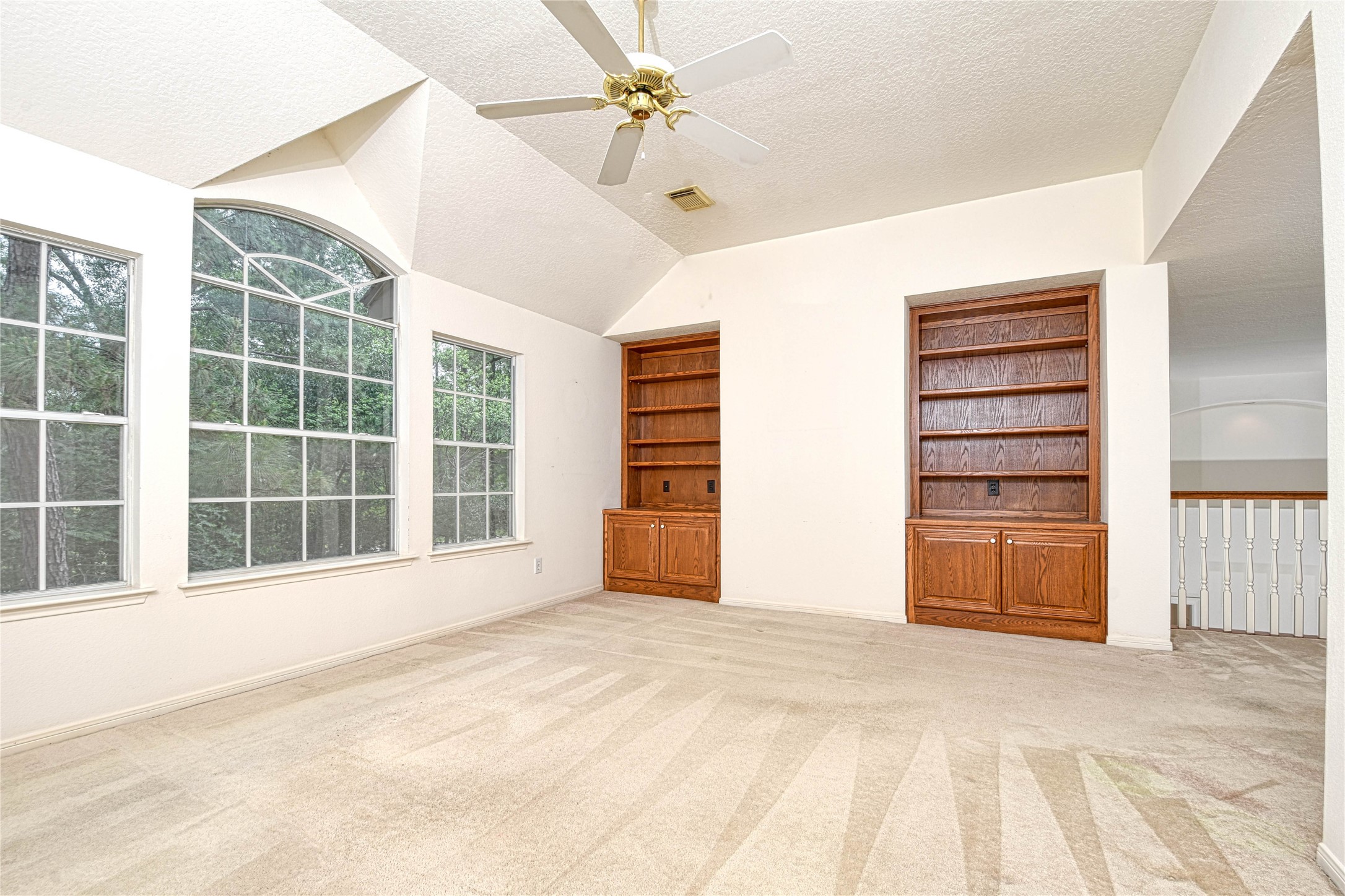 2 Woodmere Place Spring, TX 77381 - Photo 16 of 20 a view of an empty room with a window and cabinet