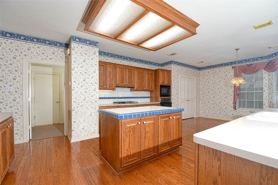 2 Woodmere Place Spring, TX 77381 - Photo 9 of 20 a kitchen that has a lot of cabinets in it