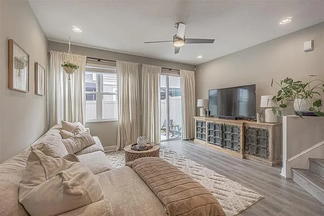 a bedroom with furniture and a flat screen tv