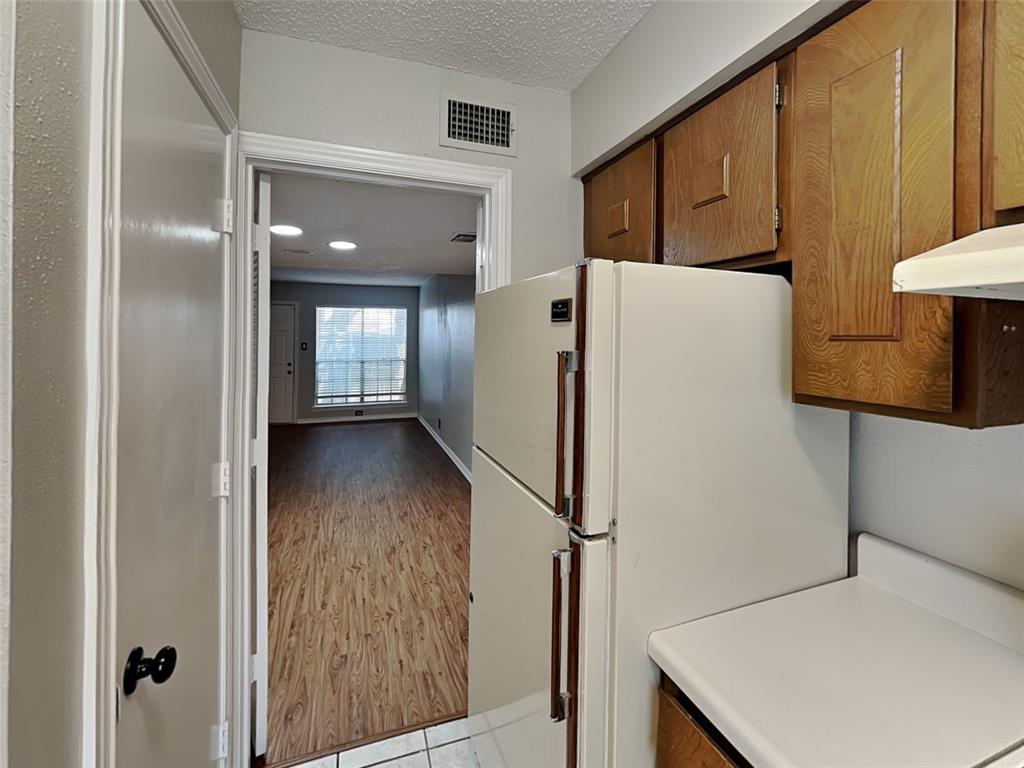 931 Roaring Springs Road Fort Worth, TX 76114 - Photo 4 of 8 a view of kitchen with furniture and refrigerator