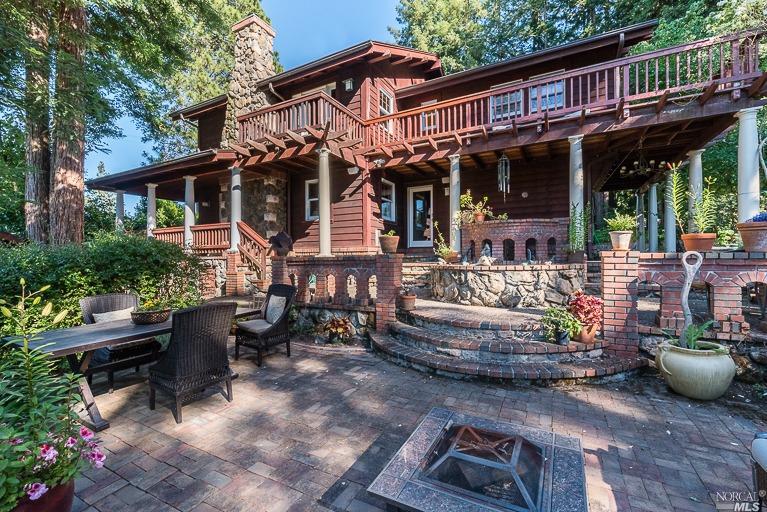1088 Pleasant Hill Road Sebastopol, CA 95472 - Photo 1 of 1 a view of a patio with table and chairs potted plants and large tree