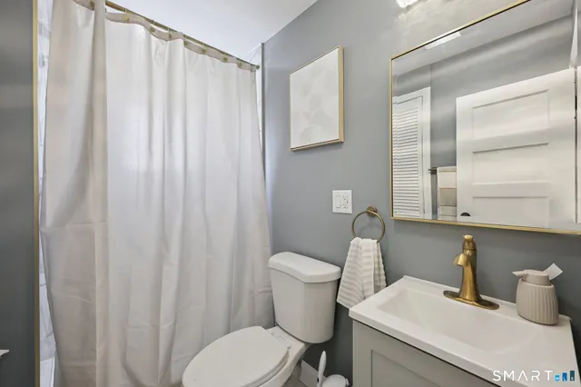 a bedroom with two beds and a dresser