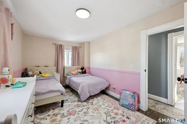 a bathroom with a sink toilet mirror and vanity
