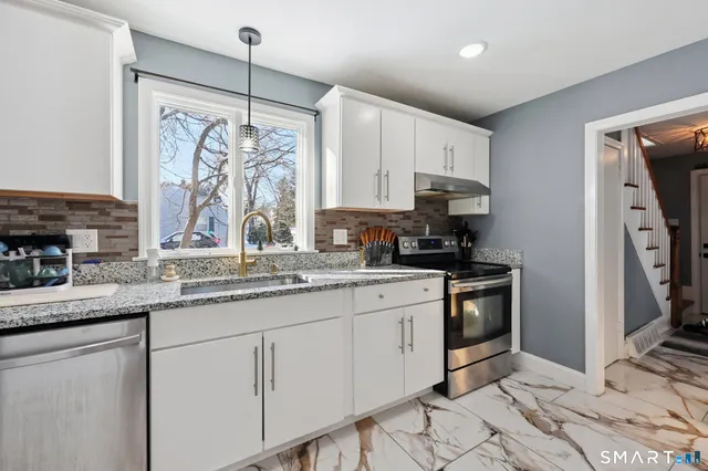a view of a dining room with furniture and window