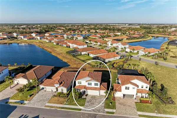 an aerial view of residential houses with outdoor space