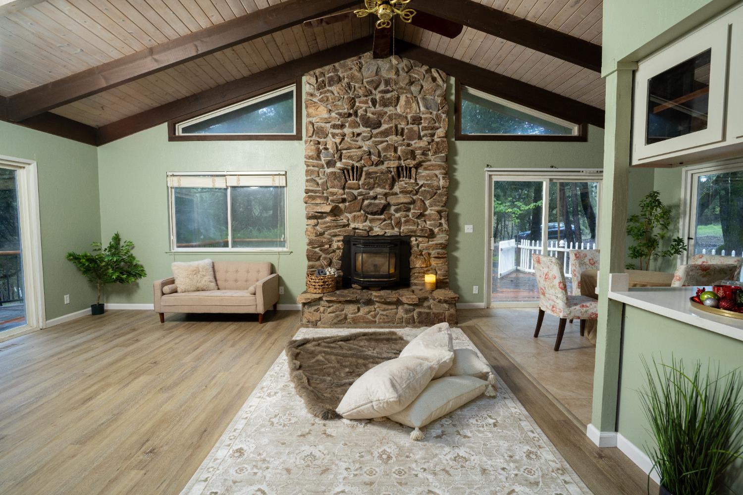6100 Shasta Road Garden Valley, CA 95633 - Photo 11 of 39 a living room with furniture and a fireplace