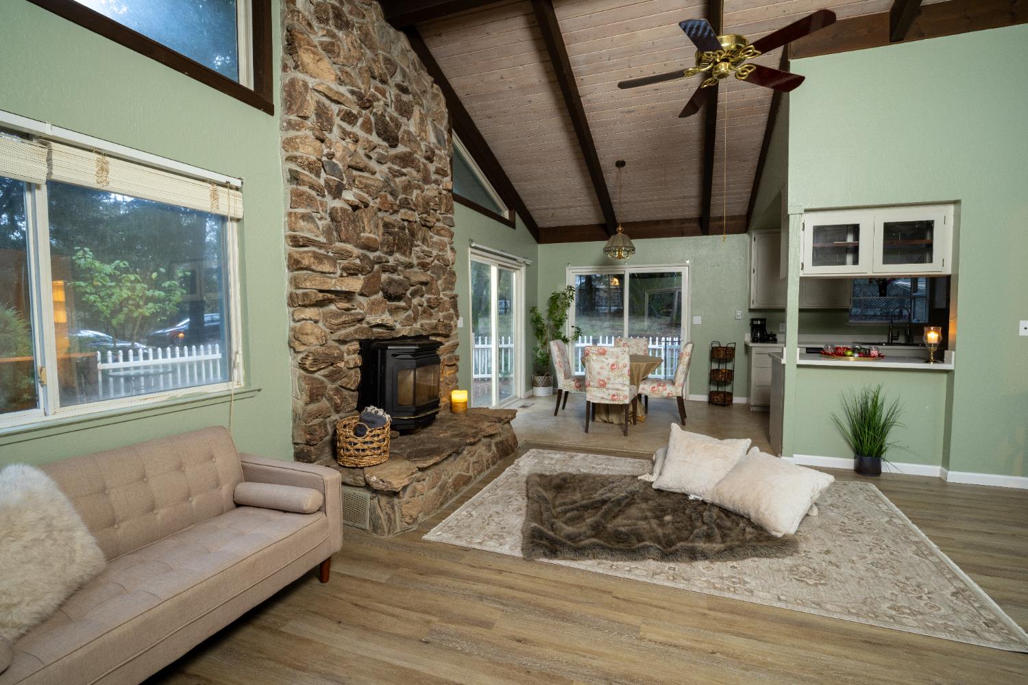 6100 Shasta Road Garden Valley, CA 95633 - Photo 12 of 39 a living room with furniture and a fireplace
