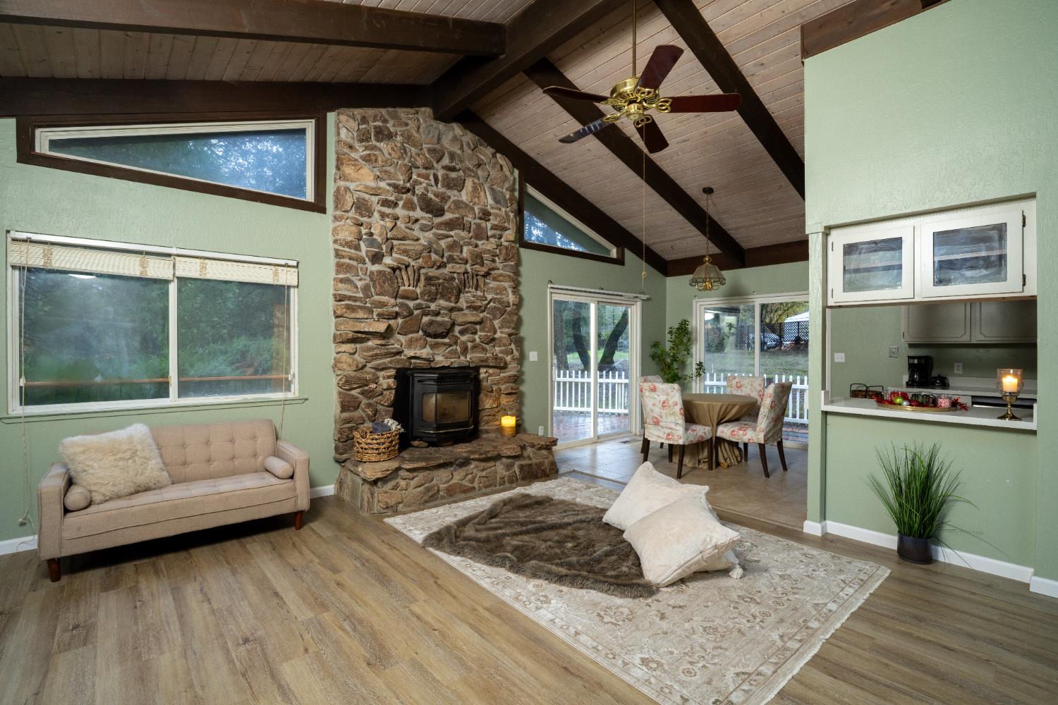 6100 Shasta Road Garden Valley, CA 95633 - Photo 13 of 39 a living room with furniture and a fireplace