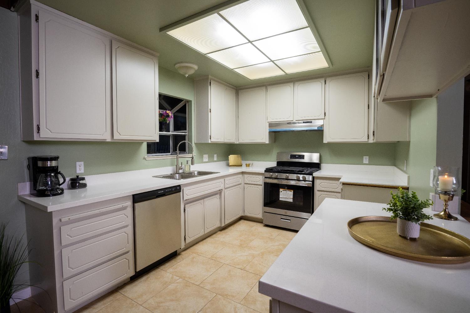6100 Shasta Road Garden Valley, CA 95633 - Photo 17 of 39 a kitchen with a sink stove and cabinets