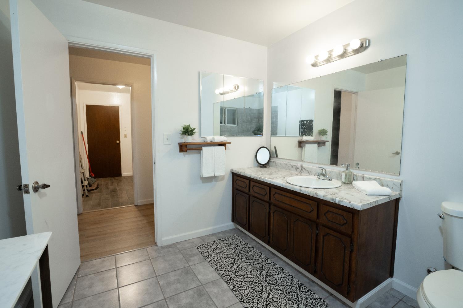 6100 Shasta Road Garden Valley, CA 95633 - Photo 21 of 39 a bathroom with a sink a toilet and a mirror