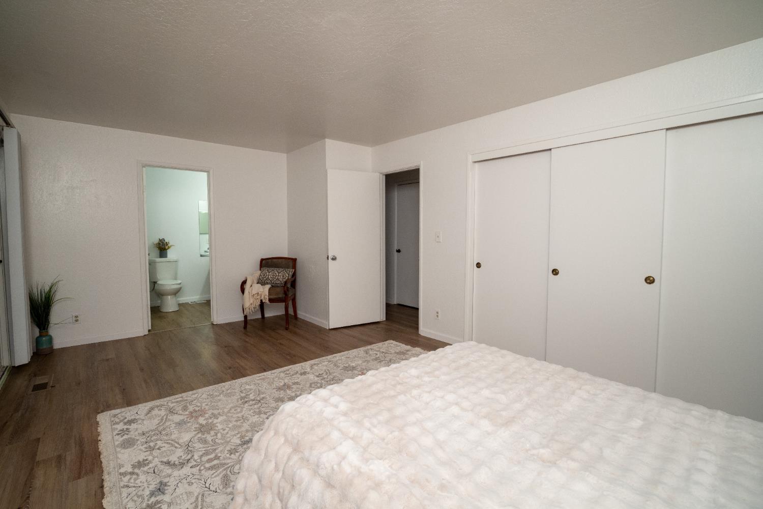 6100 Shasta Road Garden Valley, CA 95633 - Photo 23 of 39 a bedroom with a bed and a large mirror