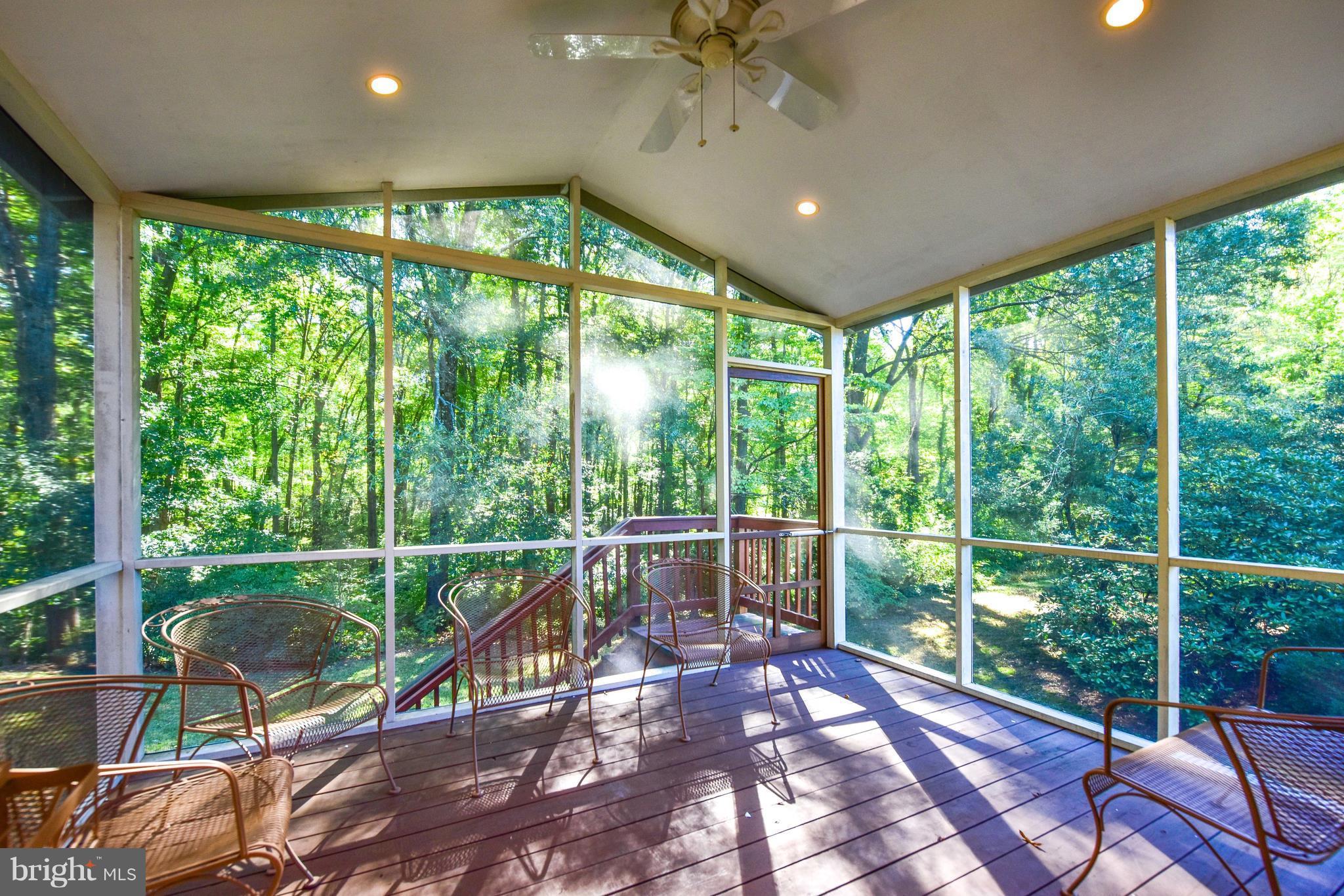 8705 Gateshead Road Alexandria, VA 22309 - Photo 27 of 30 Large screened porch in rear of house
