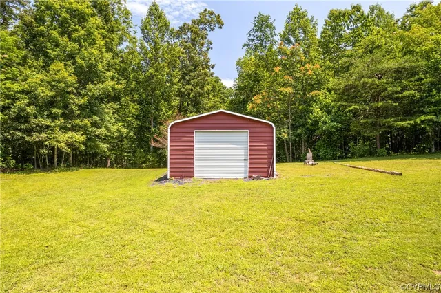 a view of a swimming pool with an outdoor space and seating area