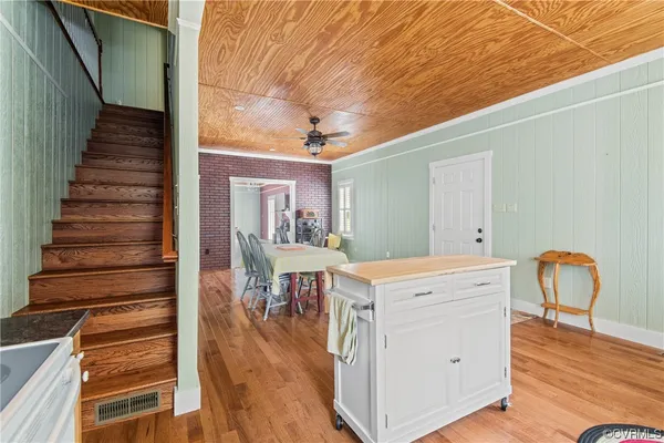 a view of a hallway with furniture and entryway