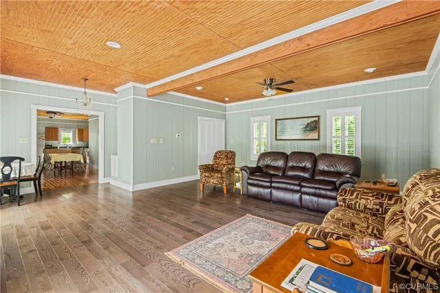 a bedroom with furniture and wooden floor