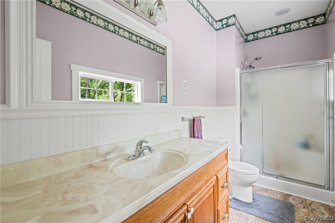 858 Chapel Road New Canton, VA 23123 - Photo 30 of 48 a bathroom with a granite countertop sink toilet and shower