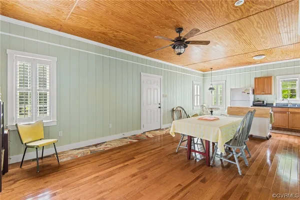 a room with furniture and a wooden floor