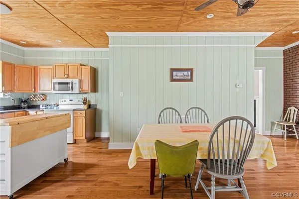 a bed sitting in a spacious bedroom next to a window