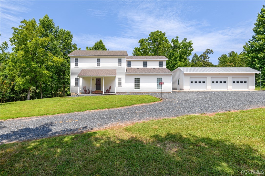 858 Chapel Road New Canton, VA 23123 - Photo 4 of 48 a view of a house with a big yard and large trees