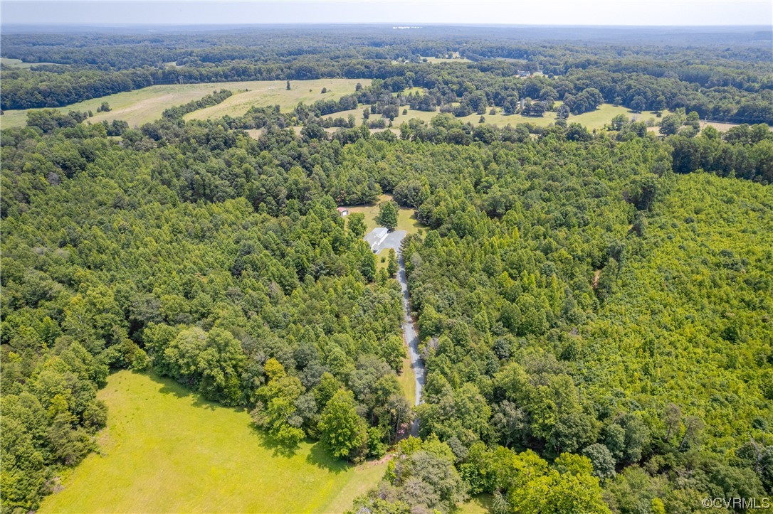858 Chapel Road New Canton, VA 23123 - Photo 44 of 48 an aerial view of a houses with a yard and lake view