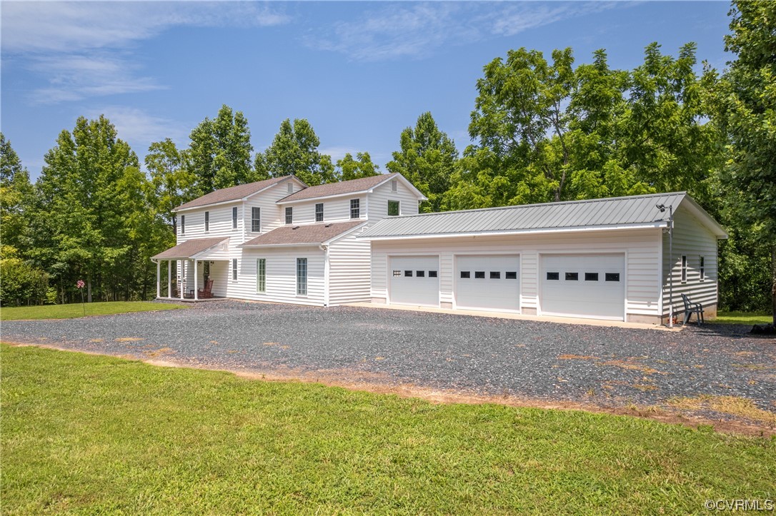 858 Chapel Road New Canton, VA 23123 - Photo 5 of 48 a view of a house with a yard and a large tree