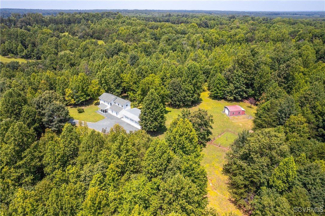 858 Chapel Road New Canton, VA 23123 - Photo 5 of 48 a view of a big yard with table and chairs