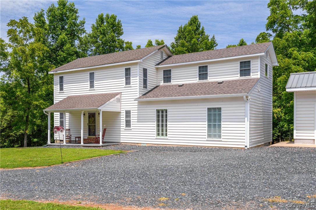 858 Chapel Road New Canton, VA 23123 - Photo 7 of 48 a view of house with a yard and potted plants
