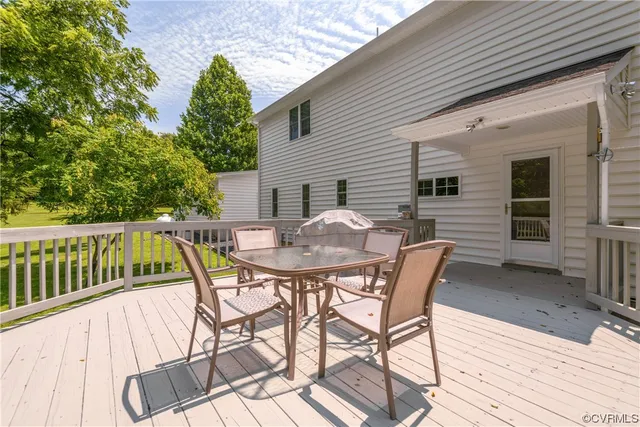 a view of a patio with a table and chairs