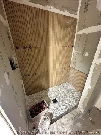 a view of a hardwood floor and staircase