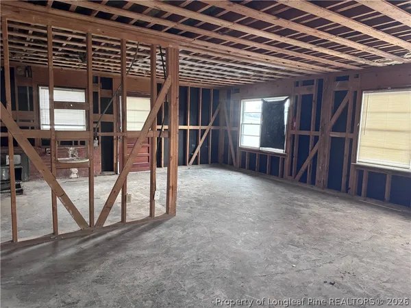 a view of a room with wooden fence