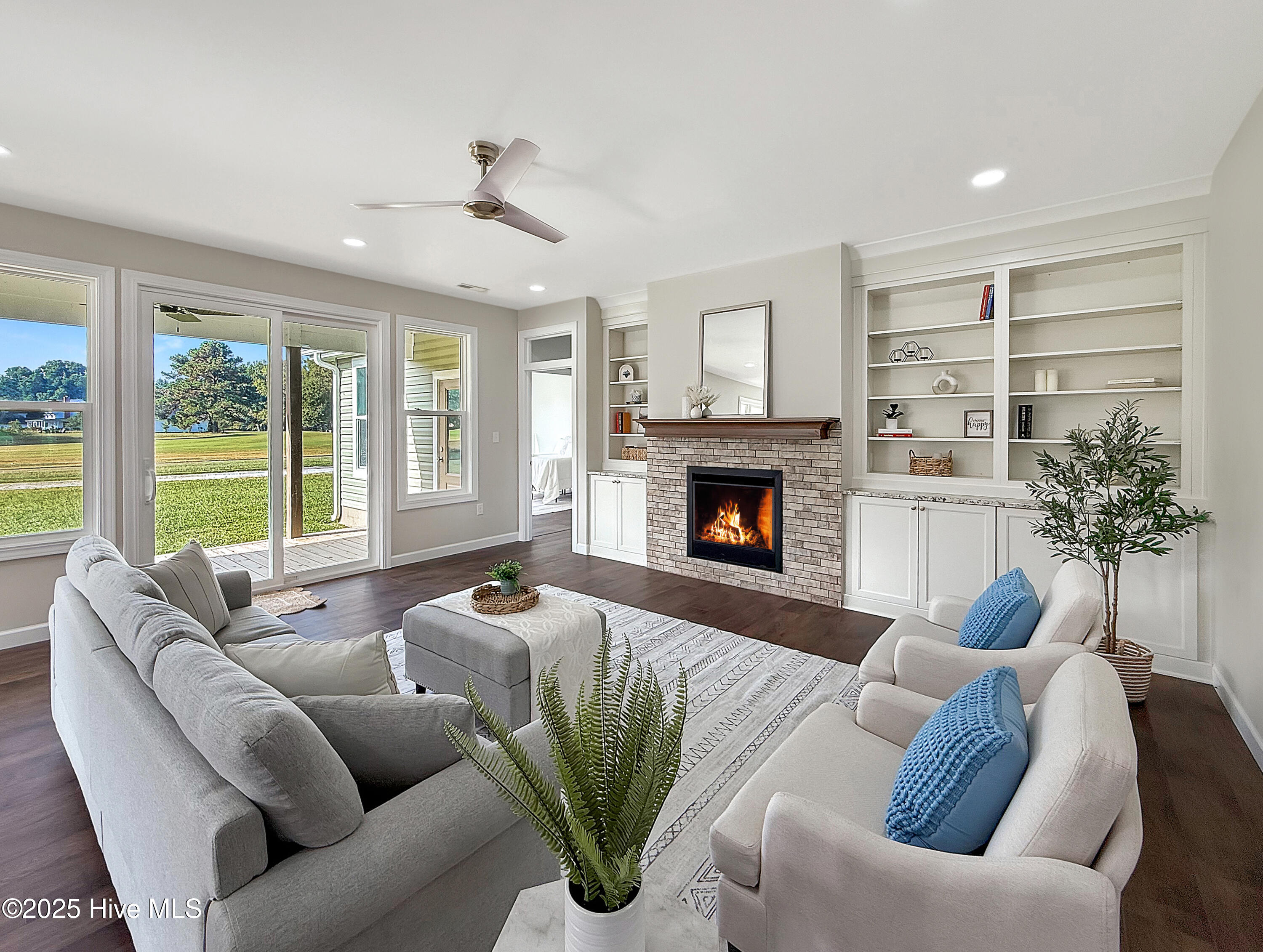 1102 Soundside Road Edenton, NC 27932 - Photo 2 of 32 Living room with fireplace and built-ins and golf course views!