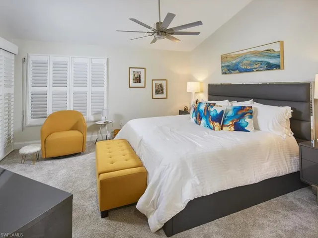 a bedroom with a bed and a couch