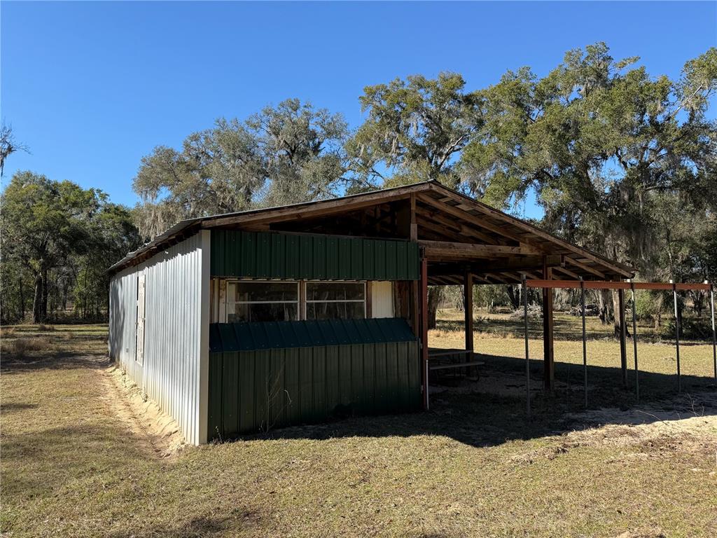 18630 Bradshaw Road Dade City, FL 33523 - Photo 3 of 43 a view of a house with a yard