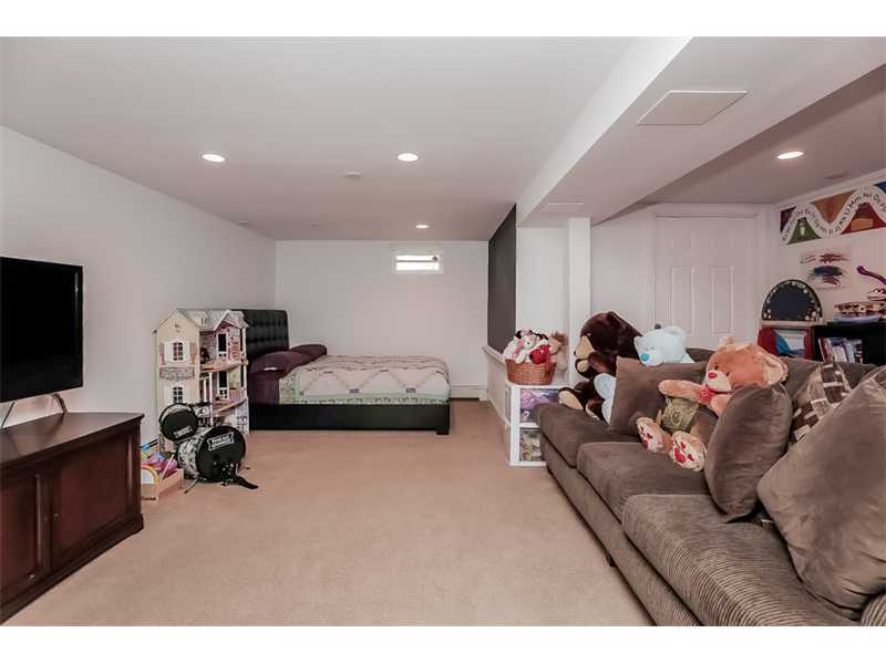 5 Archer Lane Darien, CT 06820 - Photo 12 of 17 a living room with furniture and a flat screen tv