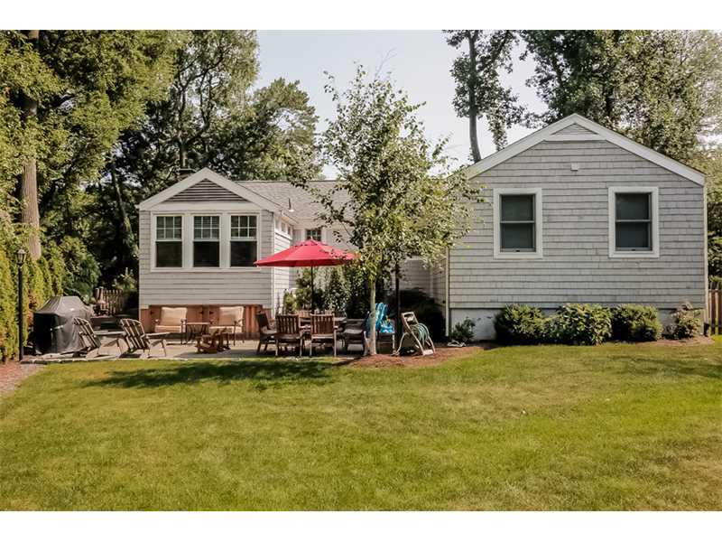 5 Archer Lane Darien, CT 06820 - Photo 13 of 17 a front view of a house with a yard patio and swimming pool