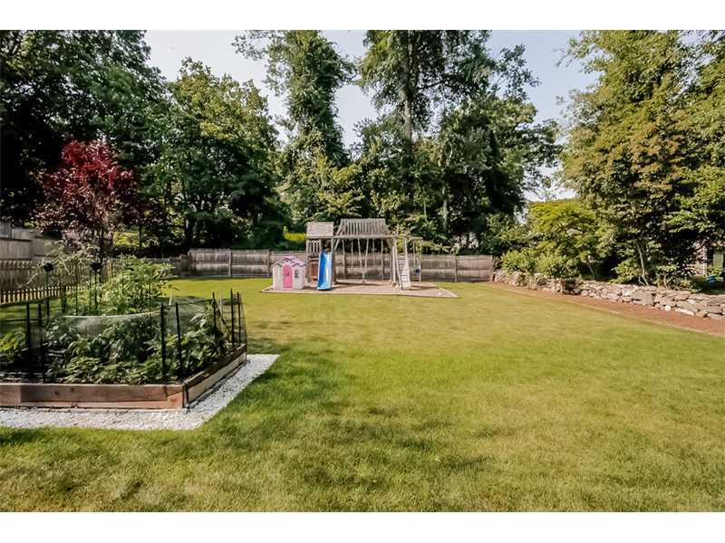 5 Archer Lane Darien, CT 06820 - Photo 14 of 17 a view of a house with a yard and swimming pool