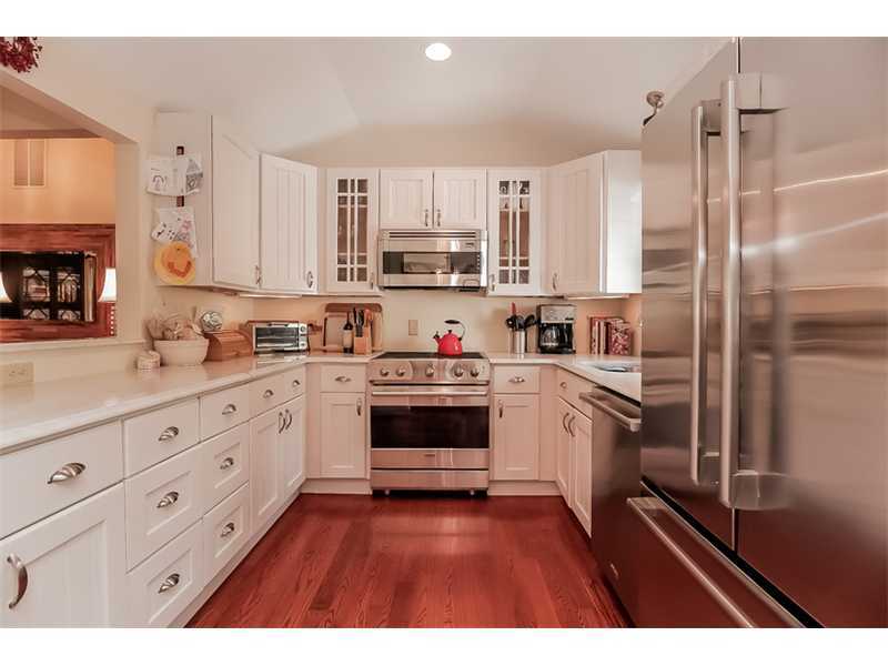5 Archer Lane Darien, CT 06820 - Photo 7 of 17 a kitchen with granite countertop a refrigerator stove top oven and sink