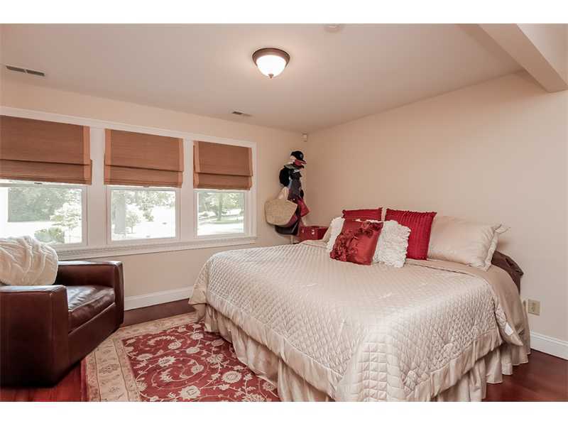 5 Archer Lane Darien, CT 06820 - Photo 8 of 17 a bedroom with a large bed and a large window