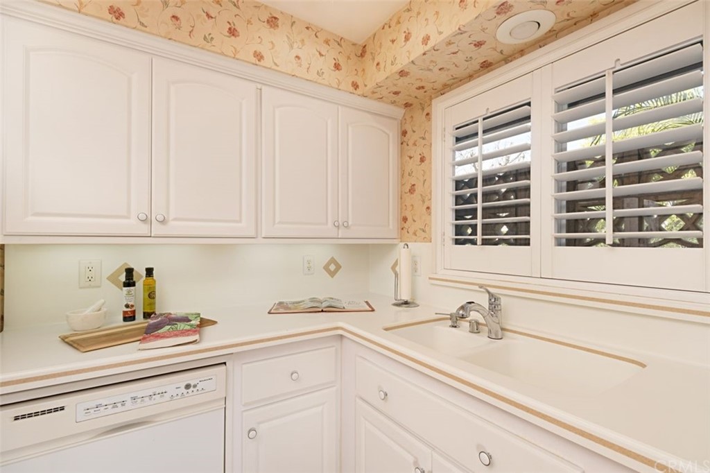 625 Rosemarie Drive Arcadia, CA 91007 - Photo 13 of 35 a kitchen with granite countertop white cabinets and a sink