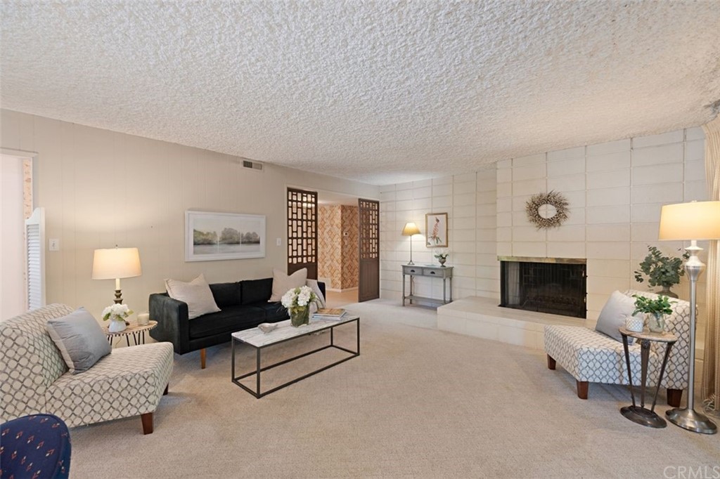 625 Rosemarie Drive Arcadia, CA 91007 - Photo 6 of 35 a living room with furniture and a fireplace