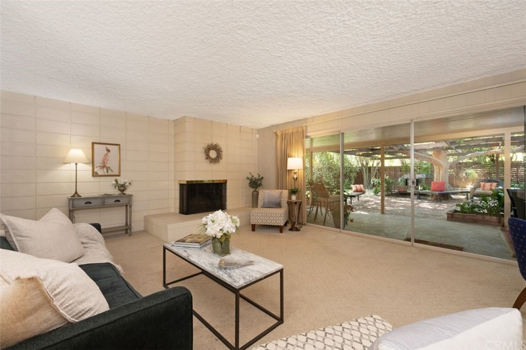 625 Rosemarie Drive Arcadia, CA 91007 - Photo 8 of 35 a living room with furniture and a flat screen tv