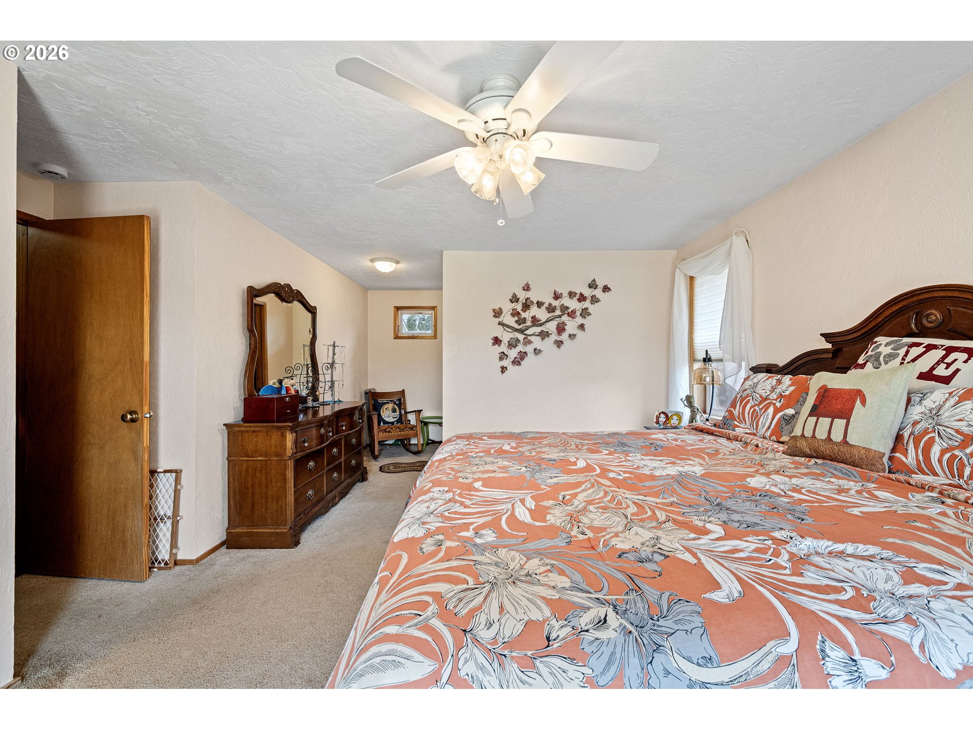2465 17th Street Springfield, OR 97477 - Photo 30 of 47 a bedroom with a bed and a chandelier