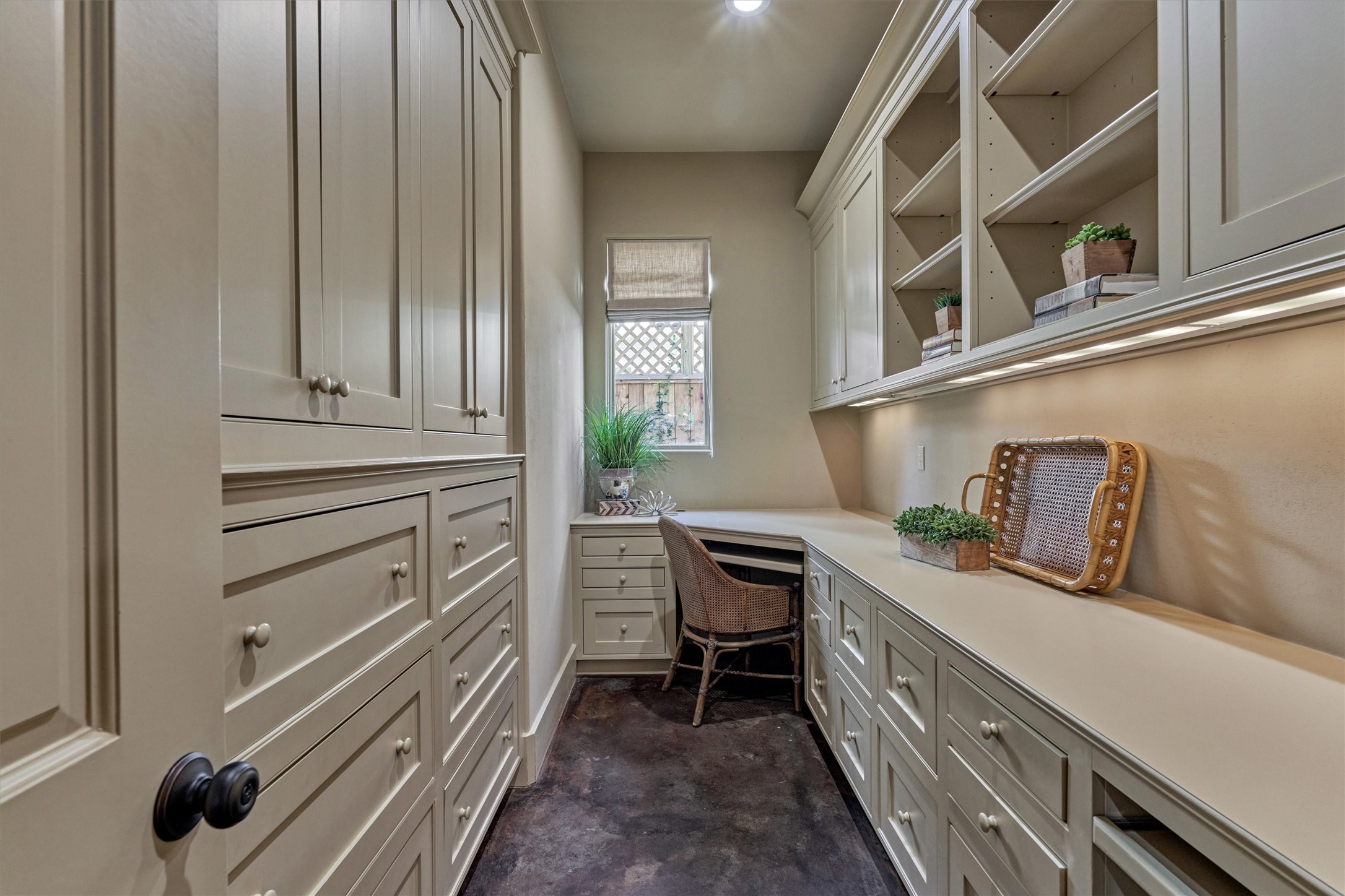 7 Dorset Square The Woodlands, TX 77381 - Photo 17 of 50 Versatile prep pantry or home office with abundant storage, including file drawers, two workstations, open shelving and keyed entry access.